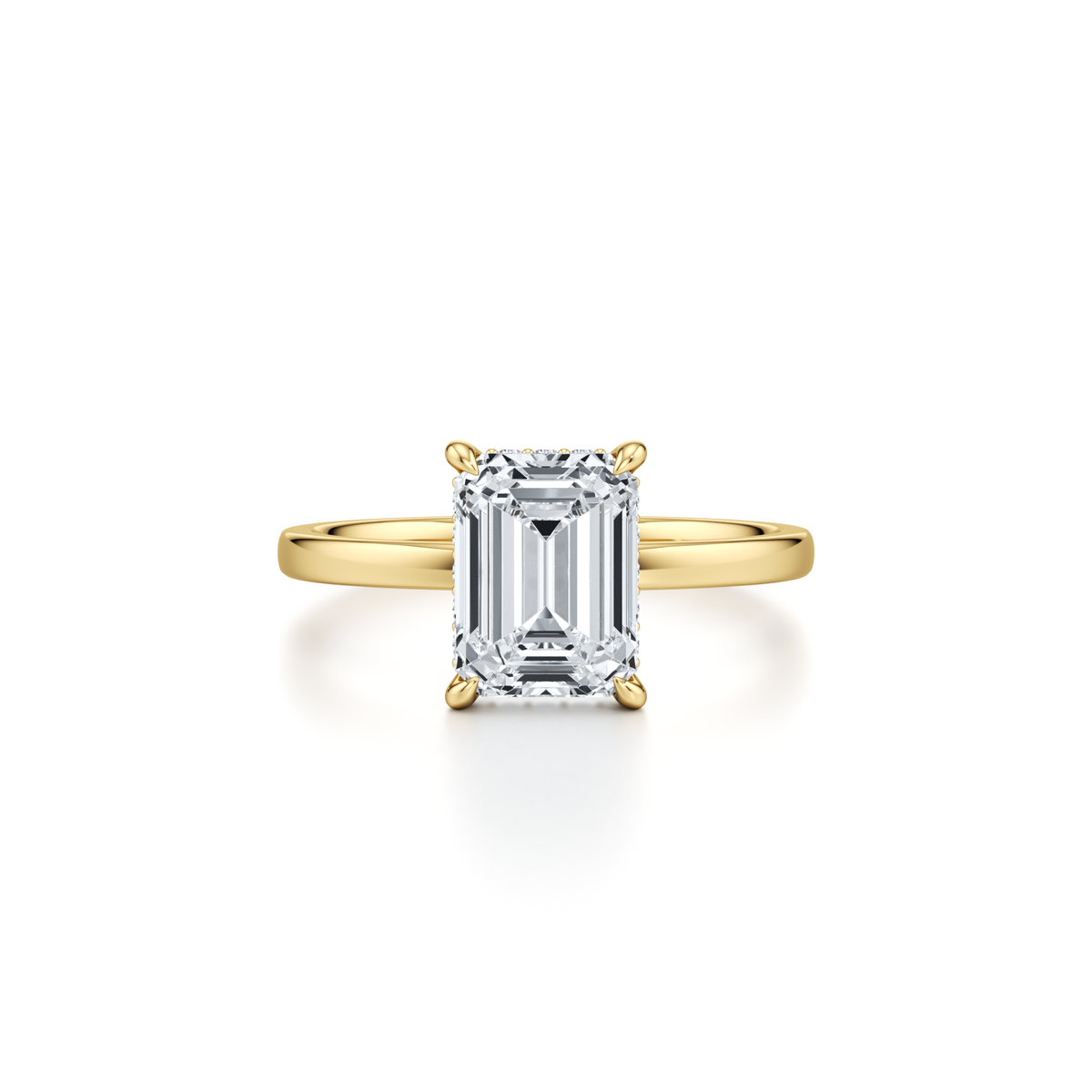 3.01 carat emerald cut lab grown diamond solitaire engagement ring with hidden halo in 14K yellow gold