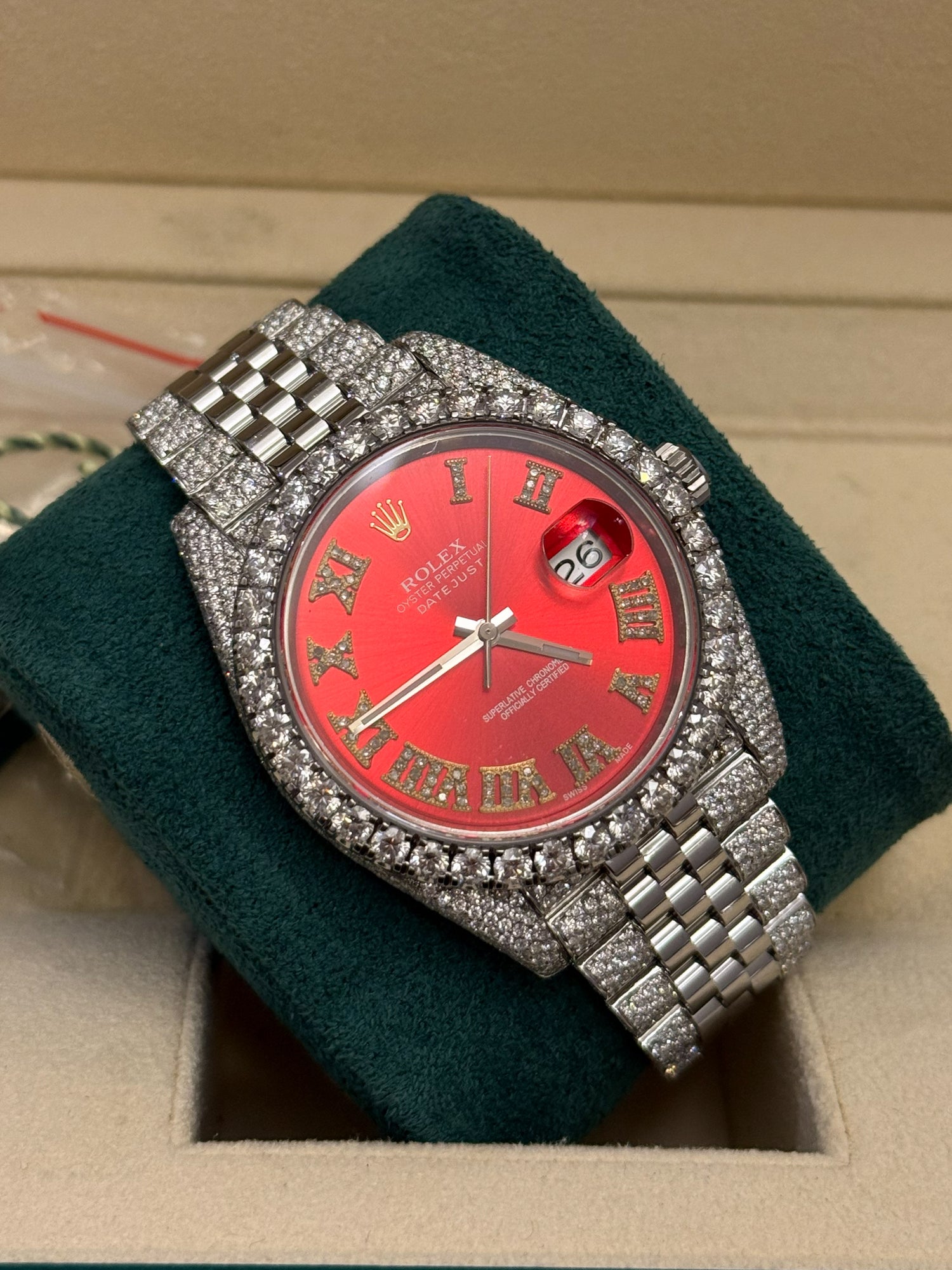 Rolex Datejust 41 on Jubilee partially iced out with sunburst red dial