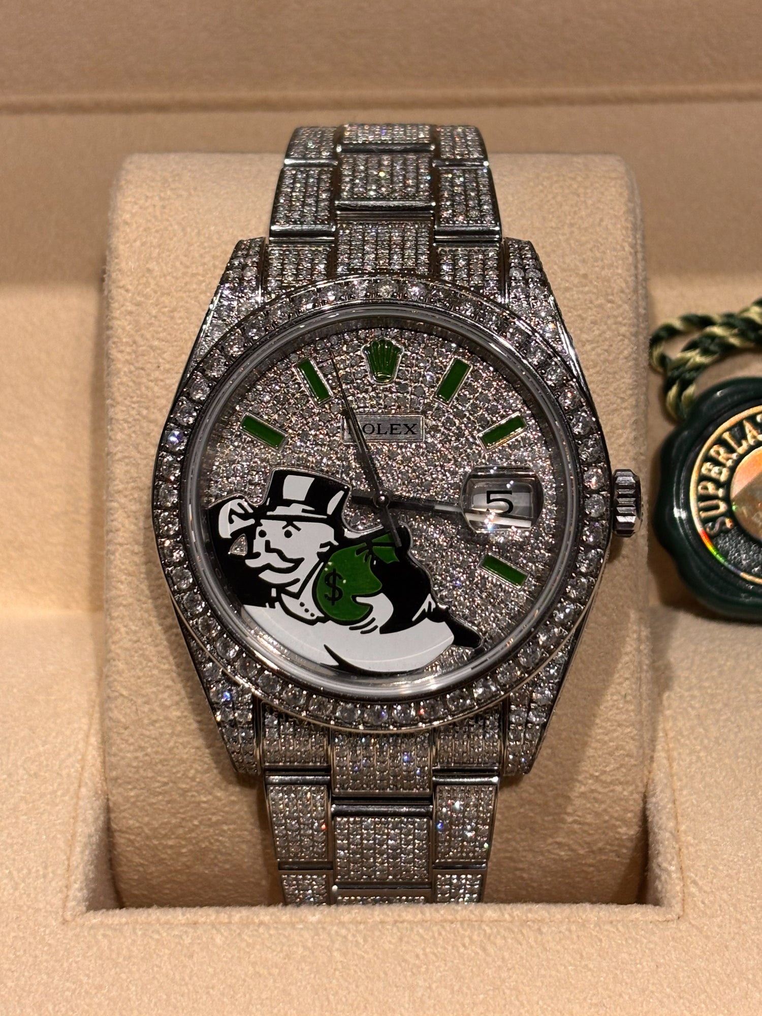 Iced out Rolex Datejust 41 with custom Monopoly Man dial and natural diamonds