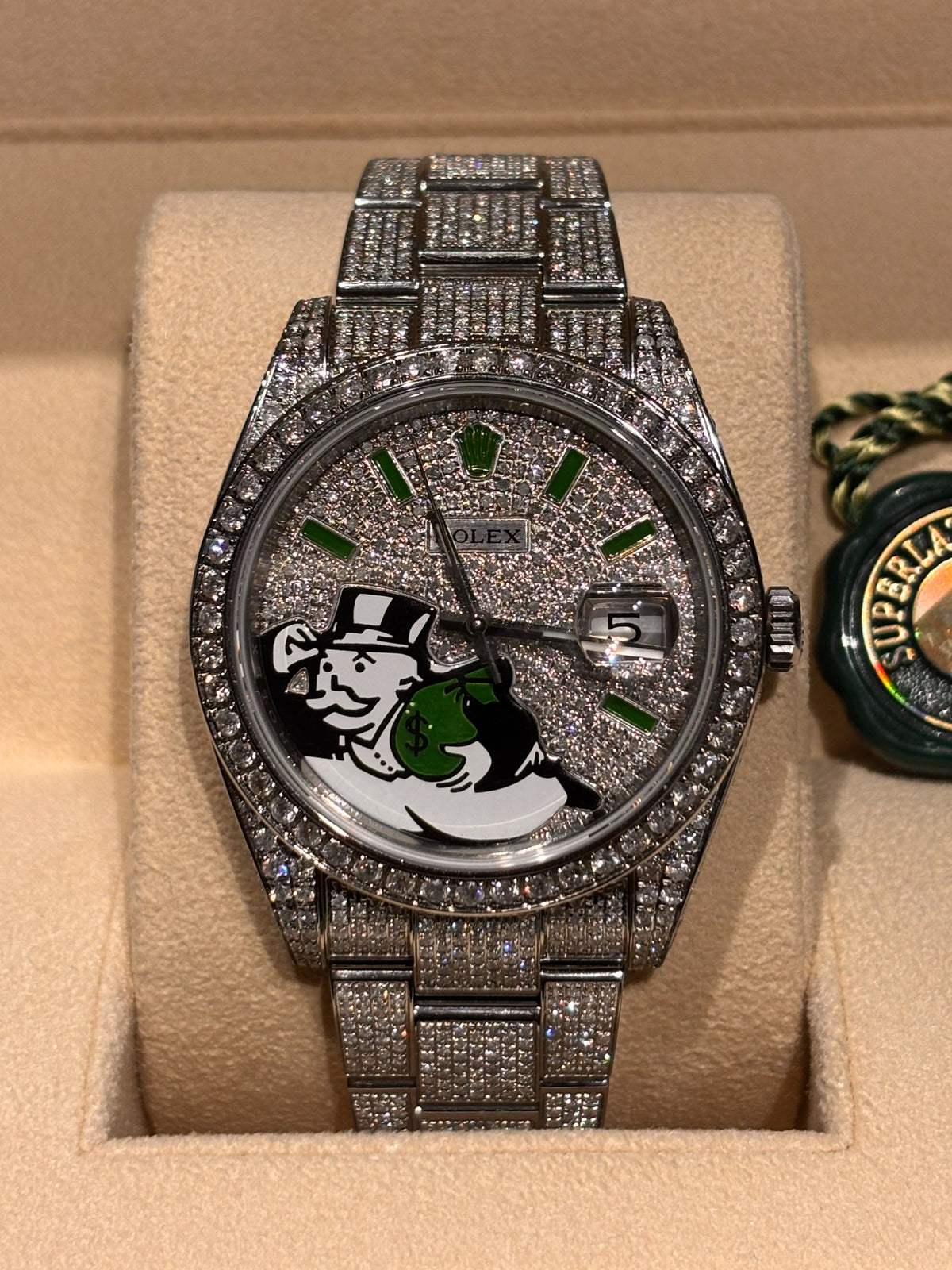 Iced out Rolex Datejust 41 with custom Monopoly Man dial and natural diamonds