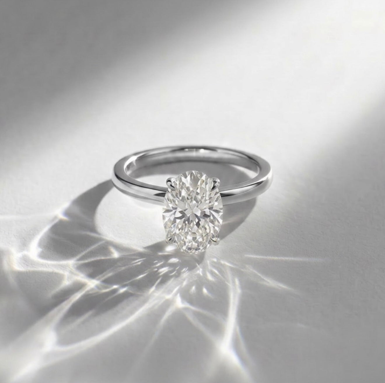 2.02ct oval lab grown diamond solitaire engagement ring with hidden halo