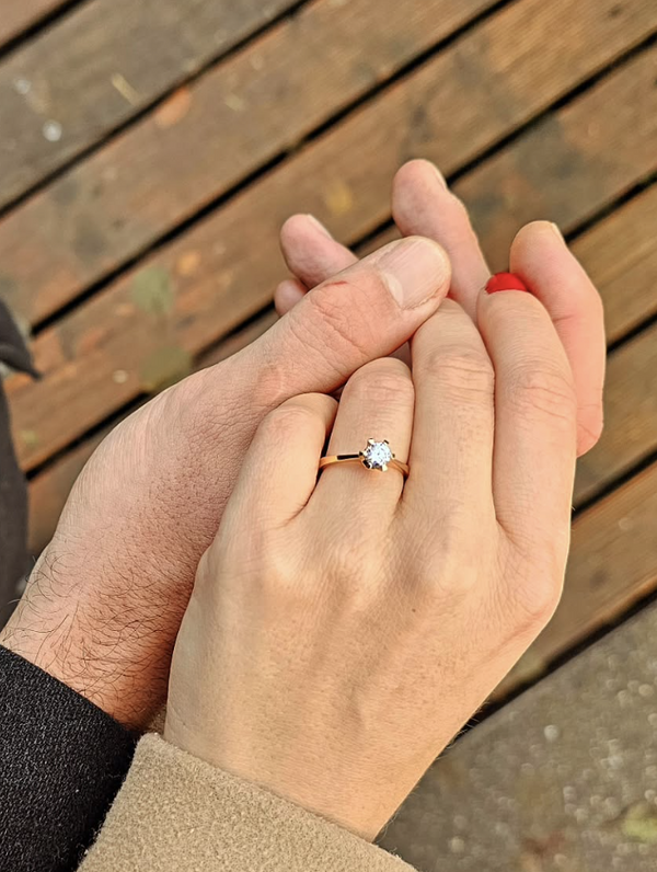 Happy Eluri customer wearing a round solitaire lab grown diamond engagement ring in yellow gold