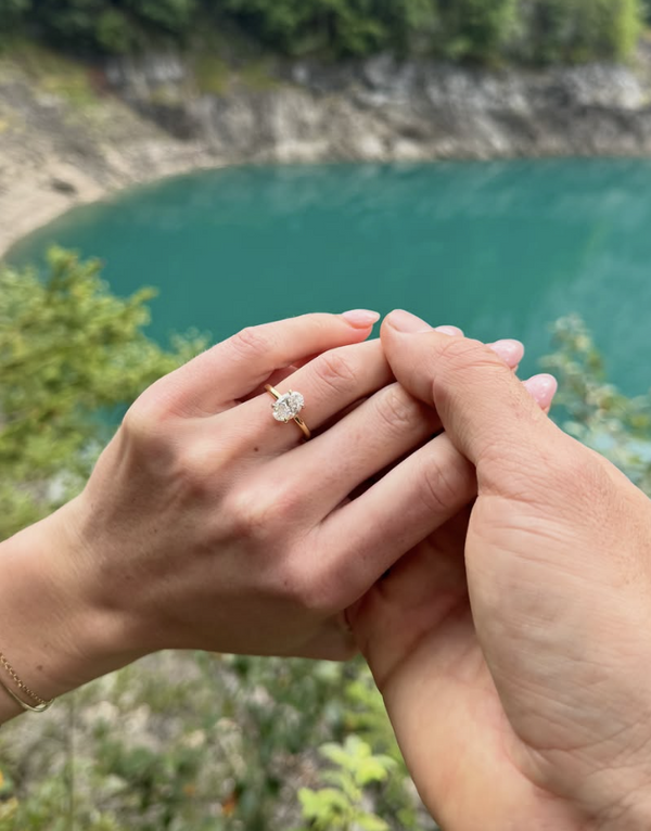 Happy Eluri customer wearing an oval lab grown diamond engagement ring in yellow gold